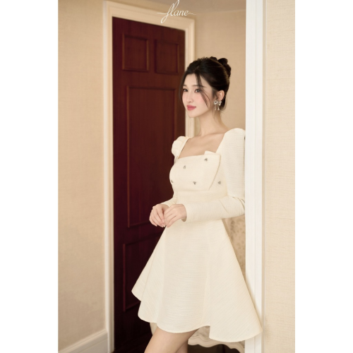 Tex Cream Square Neck Flared Mini Dress_FL131.20_FLANE Brand_เดรสบานสั้นสีครีม เดรสคอเหลี่ยมประดับหิน – วัสดุ: เท็กซ์ประดับเลื่อม รูปทรง: บานสั้น